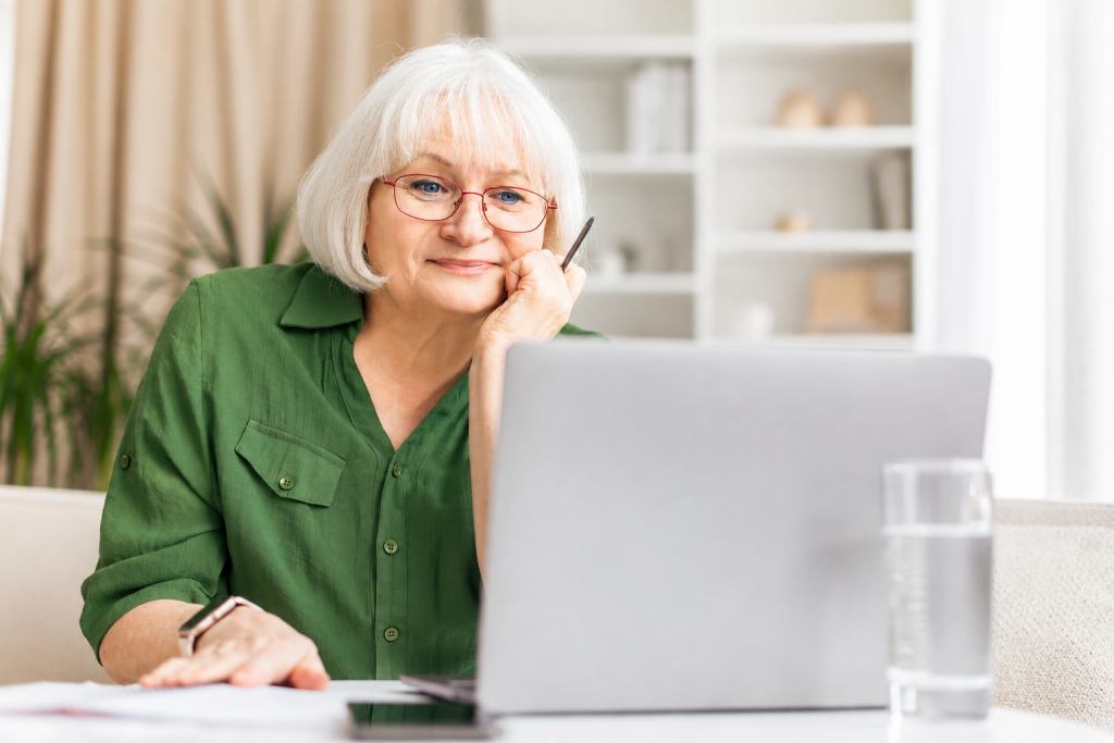 Mature woman focused on the program