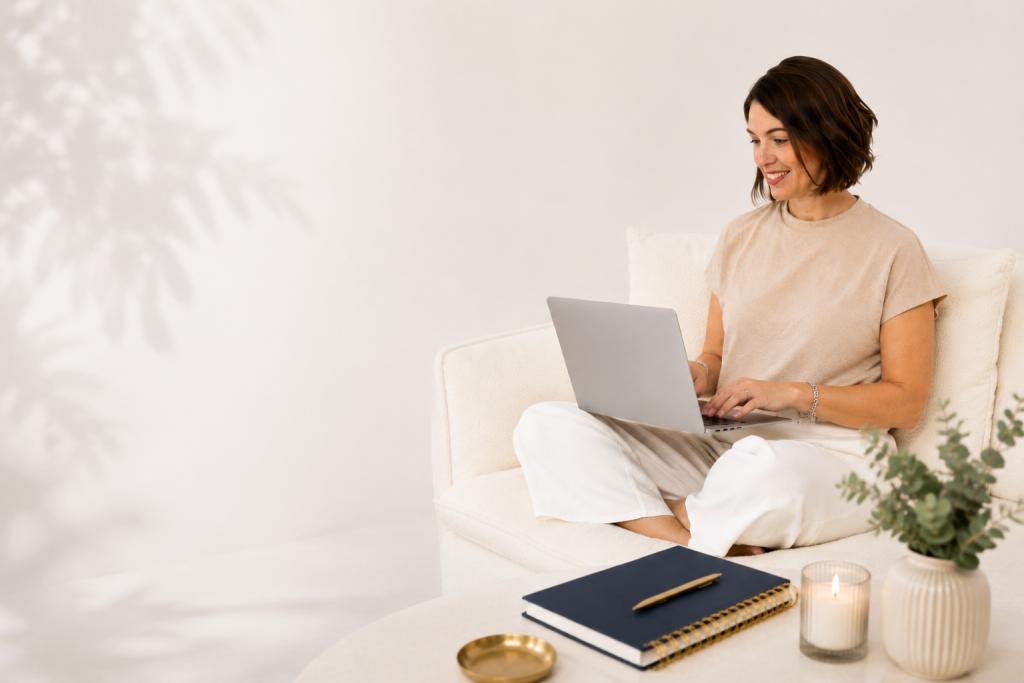 Woman sitting on a couch with her laptop, working in a peaceful, well-lit space